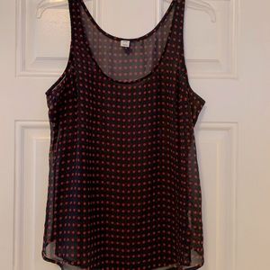 Navy sheer tank with red polka dots.